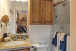 The en-suite bathroom has a single vanity and shower